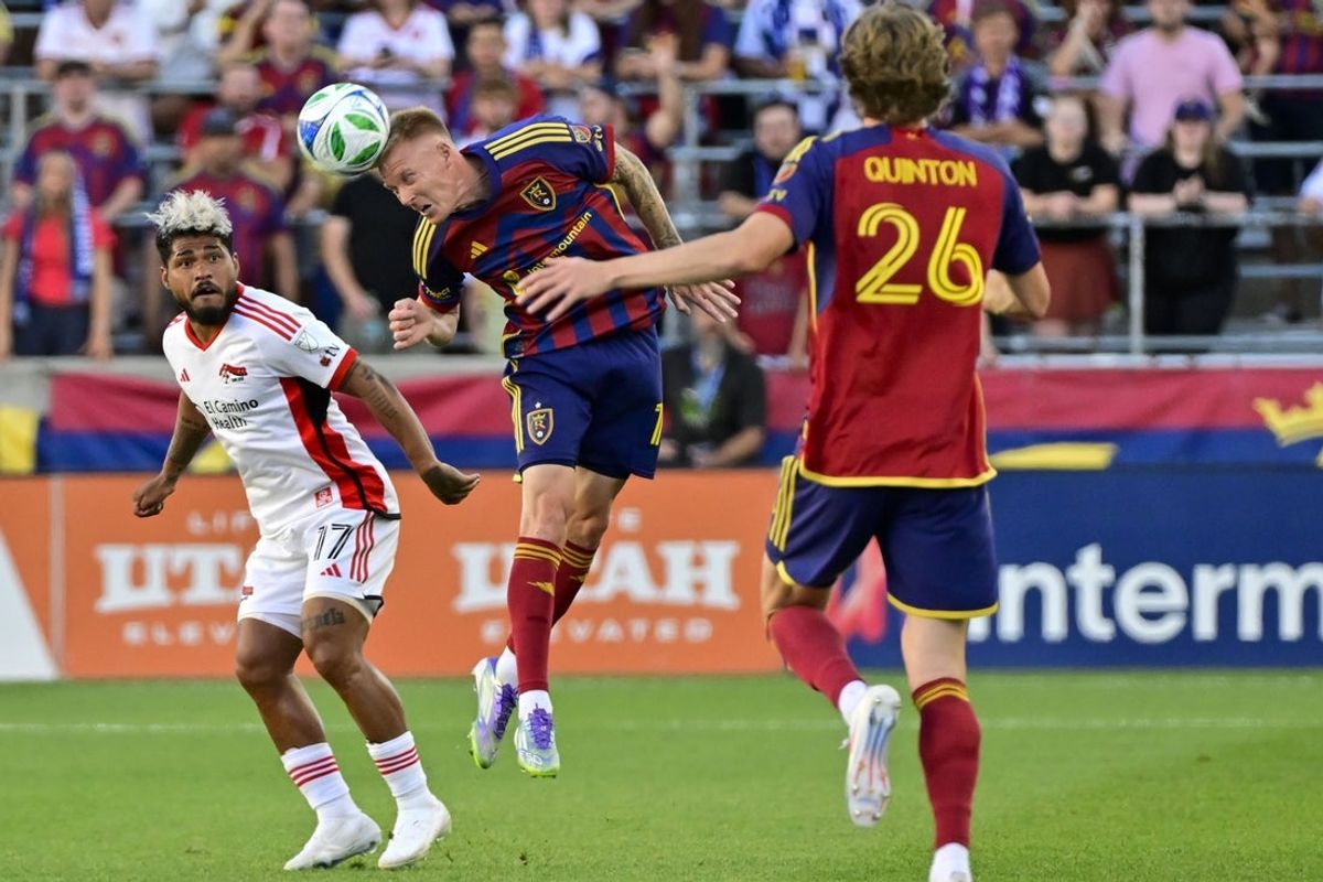 Jul 26, 2025; Sandy, Utah, USA; Real Salt Lake defender Justen Glad (15) makes a header pass against San Jose Earthquakes forward Josef Martinez (17) during the first half at America First Field. Mandatory Credit: Peter Creveling-Imagn Images