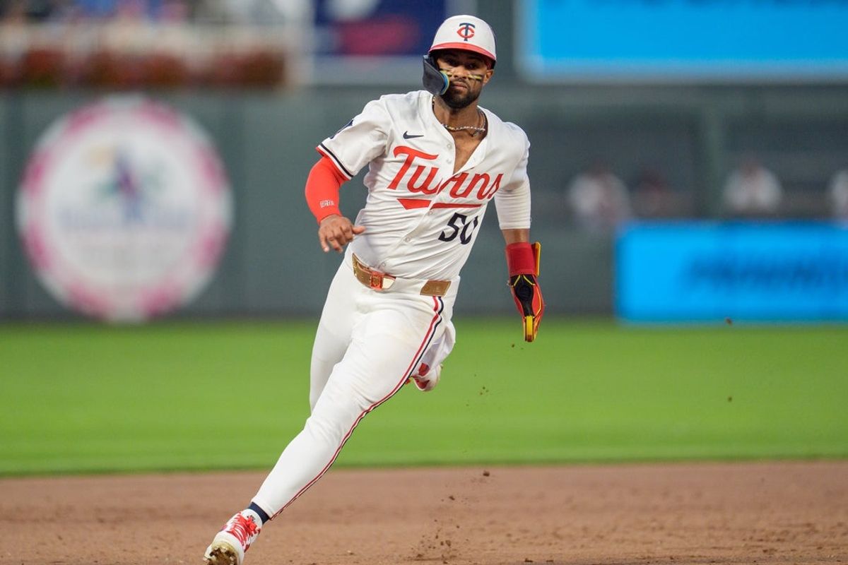 Jul 26, 2025; Minneapolis, Minnesota, USA; Minnesota Twins right fielder Willi Castro (50) rounds third on his way to home. He would be called back as left fielder Harrison Bader (12) would have his hit ruled a ground rule double in the eighth inning against the Washington Nationals at Target Field. Mandatory Credit: Matt Blewett-Imagn Images