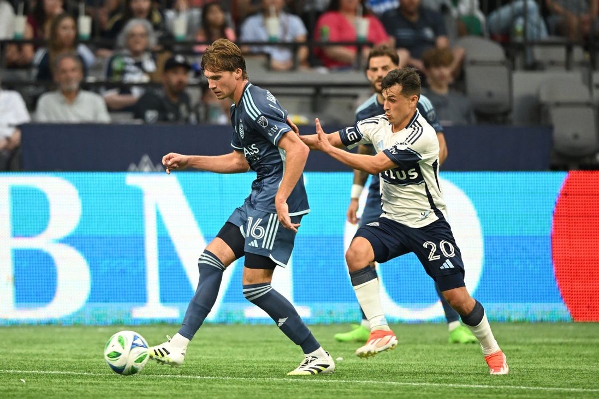 Jul 26, 2025; Vancouver, British Columbia, CAN;  Sporting Kansas City midfielder Jacob Bartlett (16) controls the ball against Vancouver Whitecaps FC midfielder Sebastian Berhalter (16) during the first half at BC Place. Mandatory Credit: Anne-Marie Sorvin-Imagn Images
