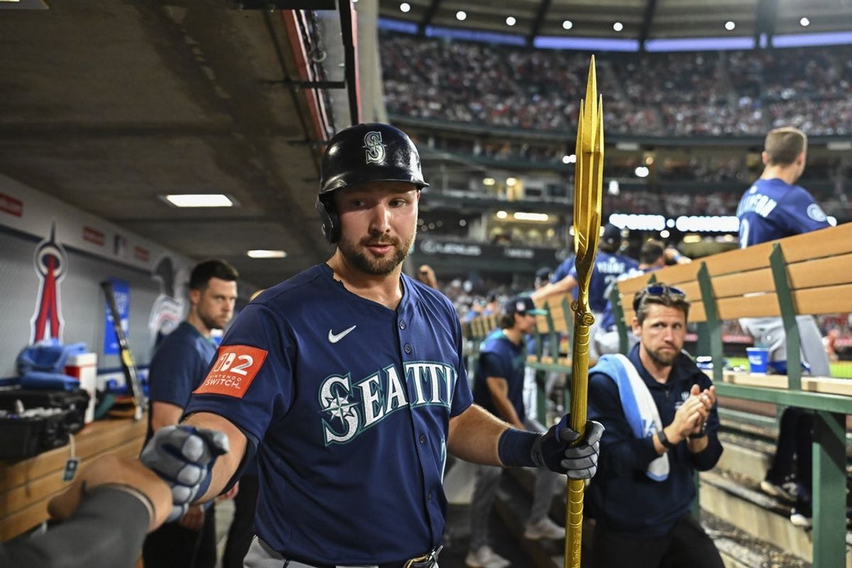 Jul 26, 2025; Anaheim, California, USA; Seattle Mariners designated hitter Cal Raleigh (29) celebrates with teammates after hitting a home run against the Los Angeles Angels during the sixth inning at Angel Stadium. Mandatory Credit: Jonathan Hui-Imagn Images
