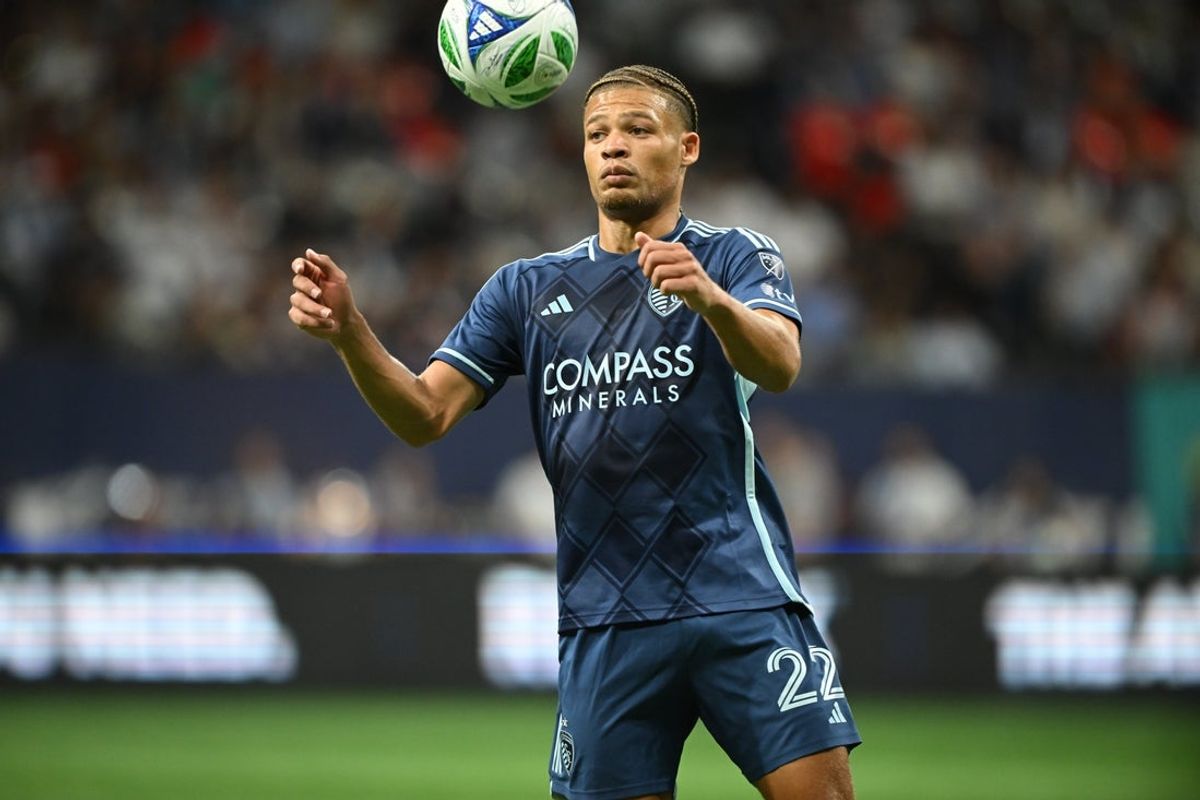 Jul 26, 2025; Vancouver, British Columbia, CAN;  Sporting Kansas City defender Zorhan Bassong (22) traps the ball during the second half against the Vancouver Whitecaps at BC Place. Mandatory Credit: Anne-Marie Sorvin-Imagn Images