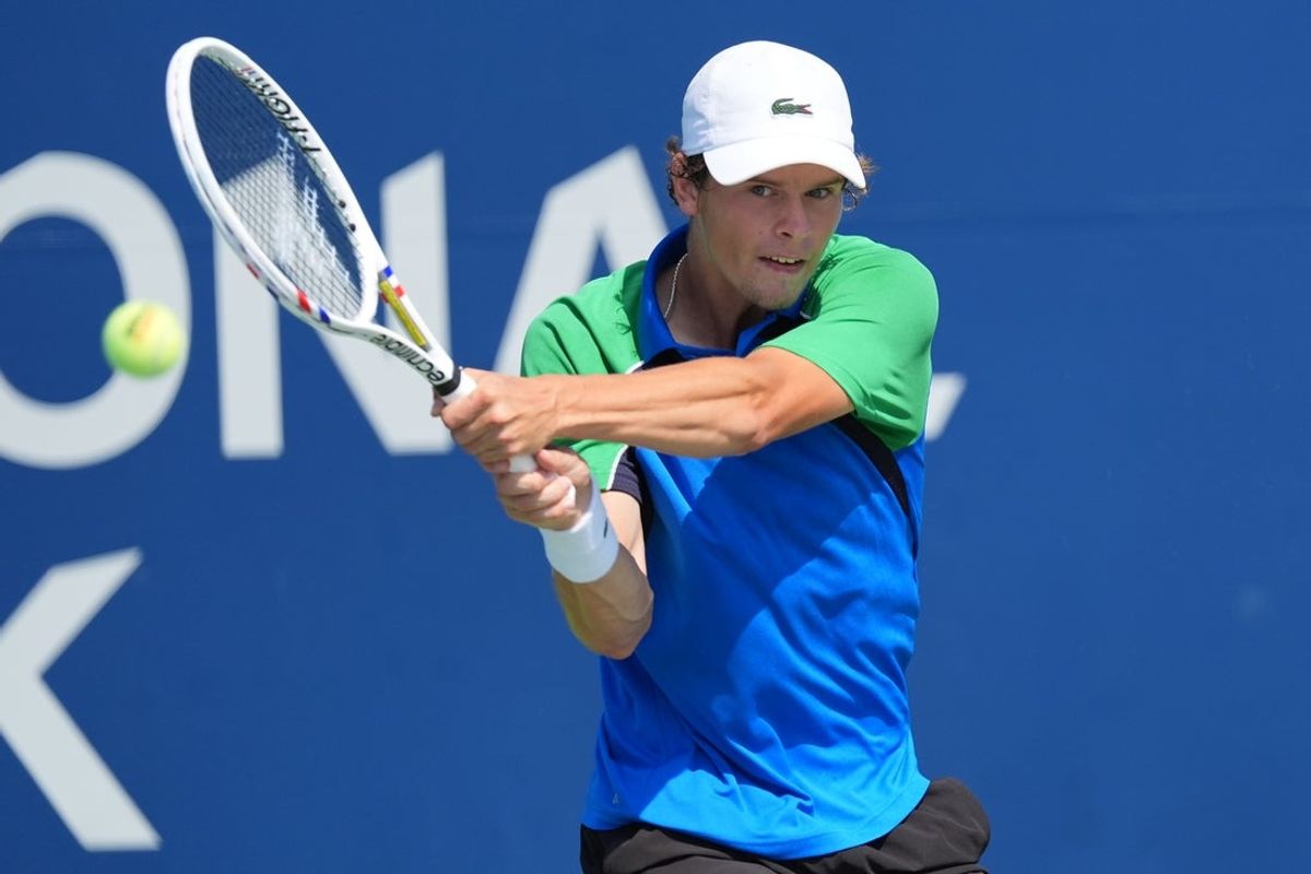 Jul 27, 2025; Toronto, ON, Canada; Alexander Blockx (BEL) hits a ball to Duje Ajdukovic (not pictured) in qualifying play at Sobeys Stadium. Mandatory Credit: John E. Sokolowski-Imagn Images