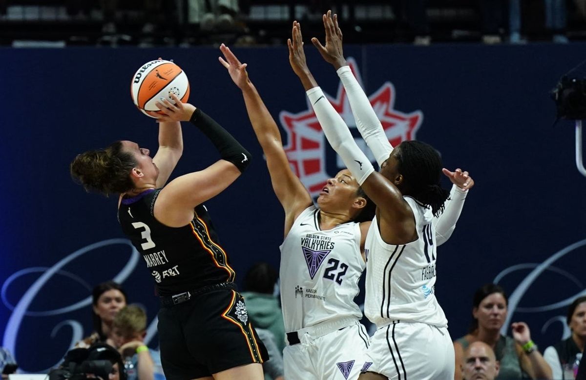 Jul 27, 2025; Uncasville, Connecticut, USA; Connecticut Sun guard Marina Mabrey (3) makes the basket and is fouled by the Golden State Valkyries in the first half at Mohegan Sun Arena. Mandatory Credit: David Butler II-Imagn Images