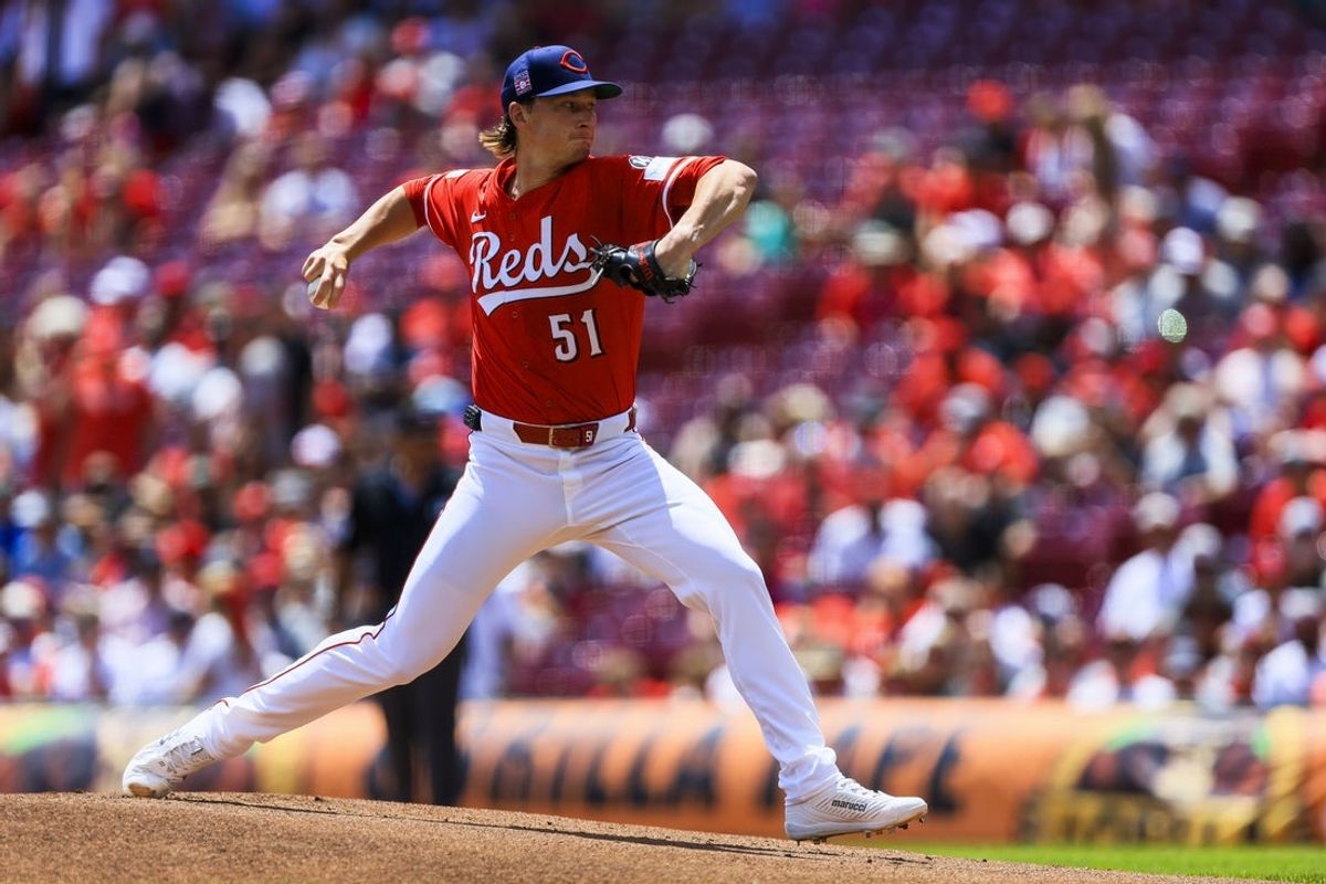 Jul 27, 2025; Cincinnati, Ohio, USA; Cincinnati Reds starting pitcher Brady Singer (51) pitches against the Tampa Bay Rays in the first inning at Great American Ball Park. Mandatory Credit: Katie Stratman-Imagn Images