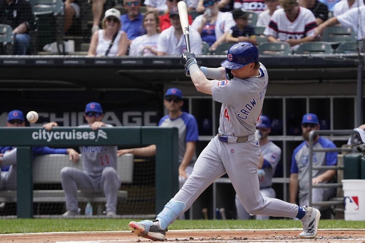 Jul 27, 2025; Chicago, Illinois, USA; Chicago Cubs outfielder Pete Crow-Armstrong (4) hits a two-run double against the Chicago White Sox during the first inning at Rate Field. Mandatory Credit: David Banks-Imagn Images