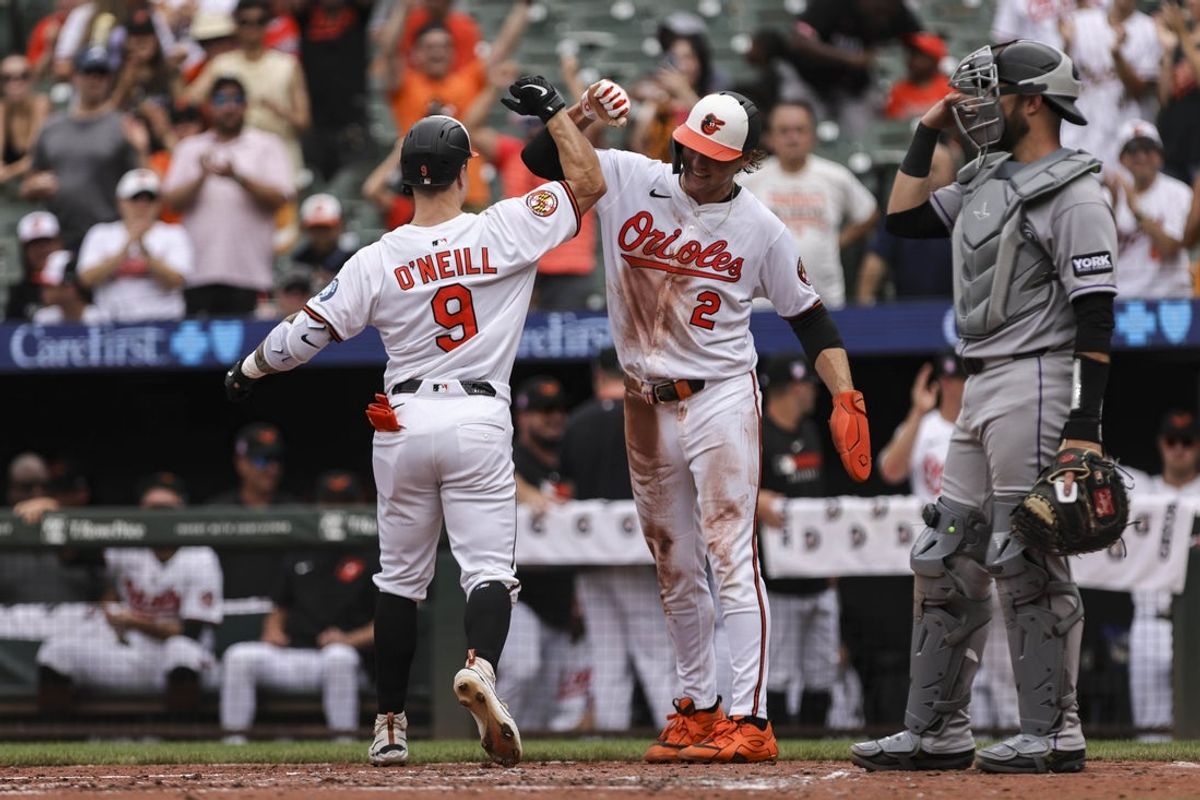Jul 27, 2025; Baltimore, Maryland, USA;  Baltimore Orioles’ designated hitter Tyler O'Neill (9) celebrates two run home run in the third inning against the Colorado Rockies with Baltimore Orioles’ shortstop Gunnar Henderson (2) at Oriole Park at Camden Yards. Mandatory Credit: Lexi Thompson-Imagn Images