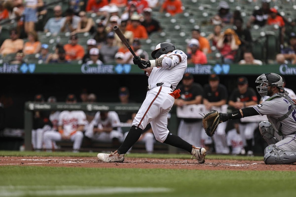Jul 27, 2025; Baltimore, Maryland, USA;  Baltimore Orioles’ designated hitter Tyler O'Neill (9) scores a two run home run in the third inning against the Colorado Rockies at Oriole Park at Camden Yards. Mandatory Credit: Lexi Thompson-Imagn Images