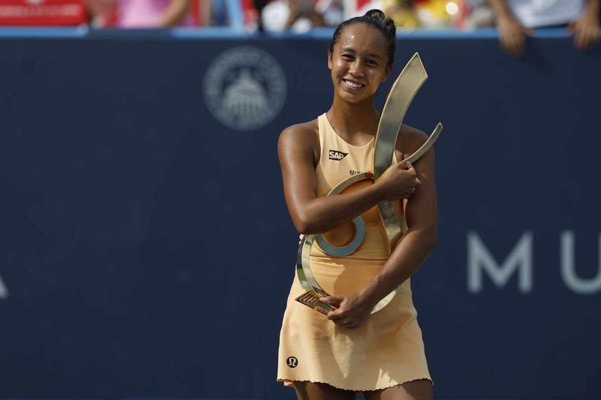 Jul 27, 2025; Washington, D.C., USA; Leylah Fernandez (CAN) celebrates with the championship trophy after her match against Anna Kalinskaya (not pictured) in the women's singles final of the Mubadala Citi DC Open at Rock Creek Park Tennis Center. Mandatory Credit: Geoff Burke-Imagn Images