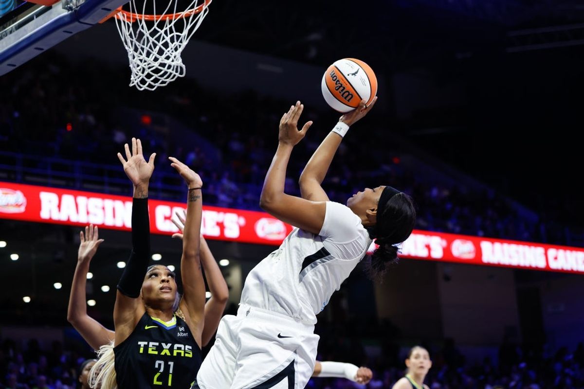 Jul 27, 2025; Arlington, Texas, USA;  Las Vegas Aces forward NaLyssa Smith (3) scores a basket over Dallas Wings guard DiJonai Carrington (21) during the first half at College Park Center. Mandatory Credit: Chris Jones-Imagn Images