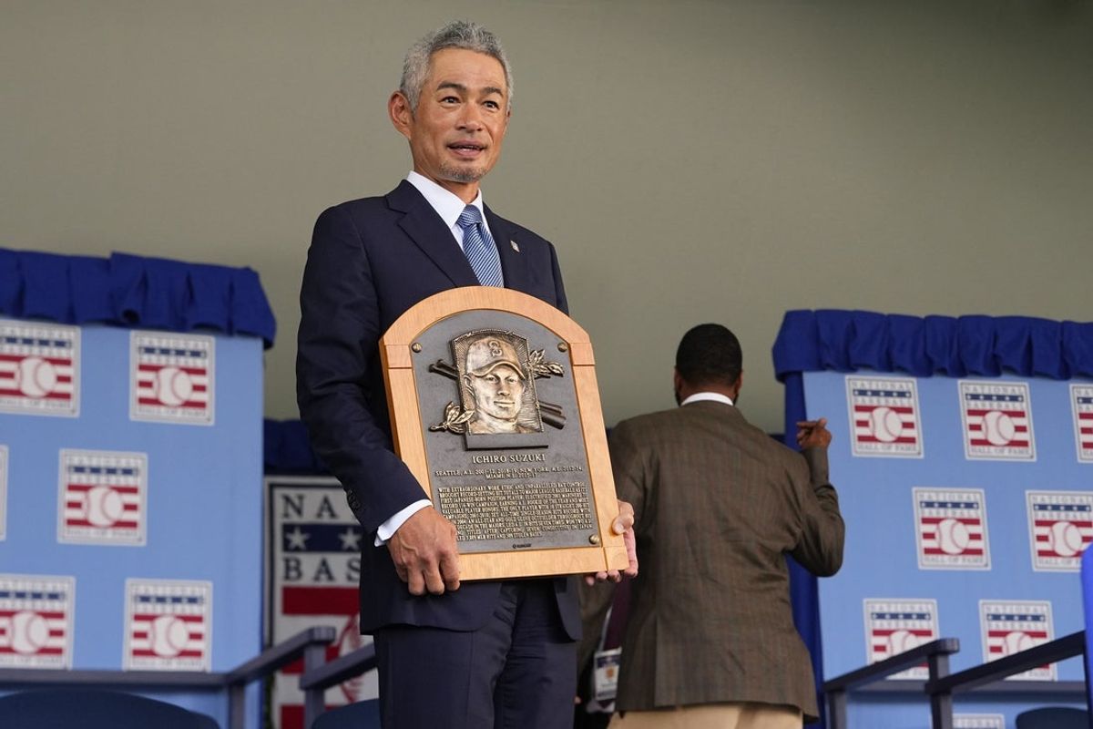 Jul 27, 2025; Cooperstown, NY, USA; Hall of Fame inductee Ichiro Suzuki poses with his Hall of Fame plaque after the Baseball Hall of Fame Induction Ceremony at the Clark Sports Center. Mandatory Credit: Gregory Fisher-Imagn Images
