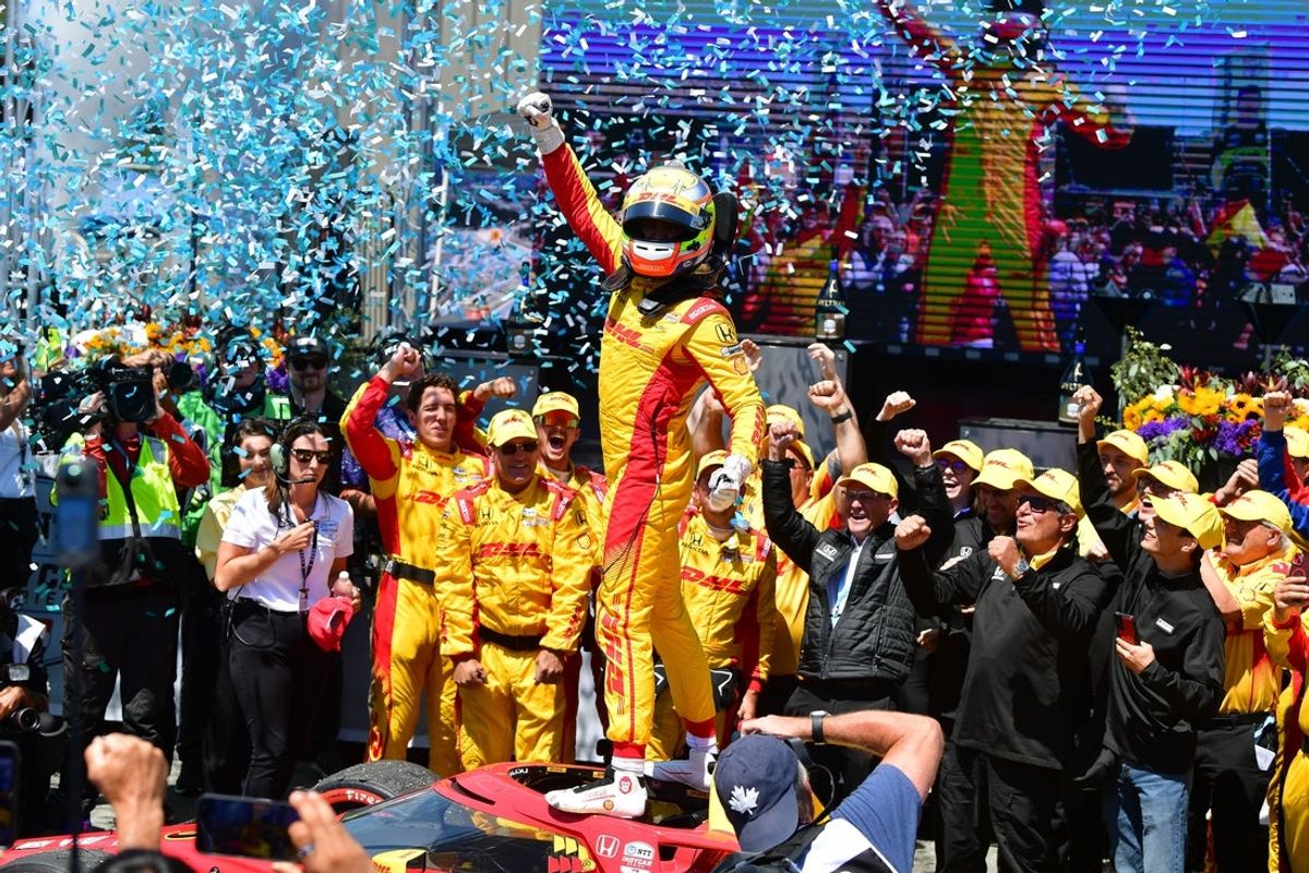 Jul 27, 2025; Salinas, California, USA; Chip Ganassi Racing driver Alex Palou (10) celebrates his victory of the Monterey Grand Prix at WeatherTech Raceway Laguna Seca. Mandatory Credit: Gary A. Vasquez-Imagn Images