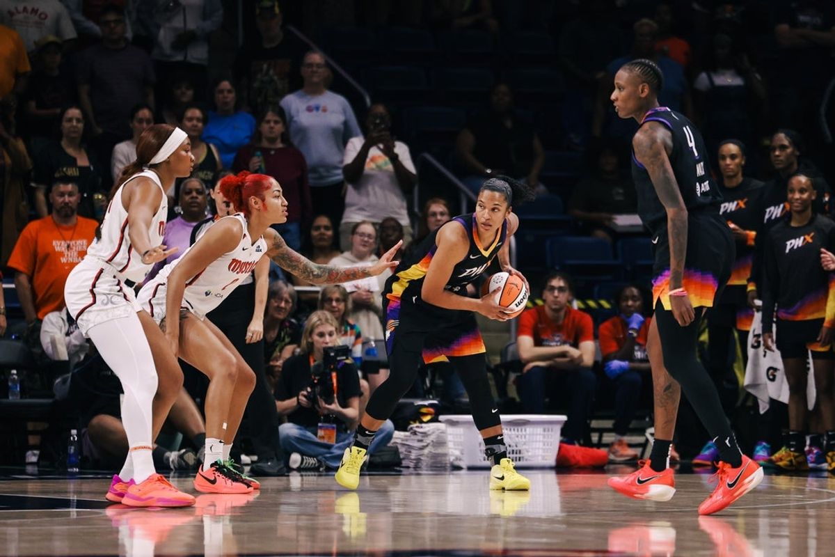 Jul 27, 2025; Washington, District of Columbia, USA; Phoenix Mercury forward Alyssa Thomas (25) controls the ball while Washington Mystics forward Shakira Austin (0) defends in the first quarter at CareFirst Arena. Mandatory Credit: Emily Faith Morgan-Imagn Images