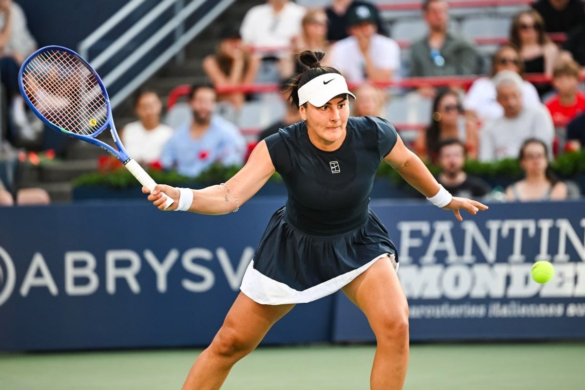 Jul 27, 2025; Montreal, QC, Canada; Bianca Andreescu (CAN) returns the ball to Barbora Krejcikova (CZE) in first round play at IGA Stadium. Mandatory Credit: David Kirouac-Imagn Images