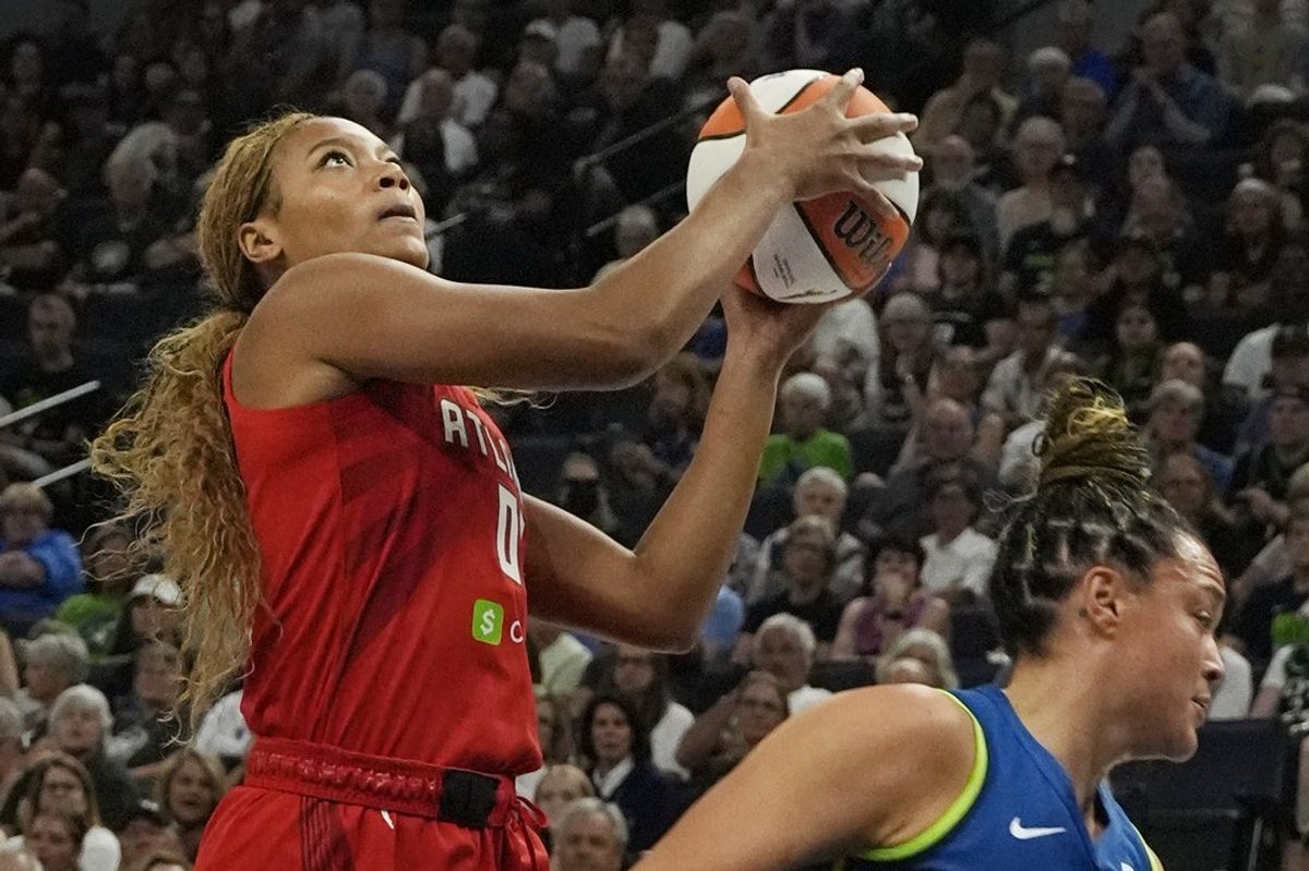 Jul 27, 2025; Minneapolis, Minnesota, USA; Atlanta Dream forward Naz Hillmon (00) goes to the basket against the Minnesota Lynx in the first quarter at Target Center. Mandatory Credit: Bruce Kluckhohn-Imagn Images