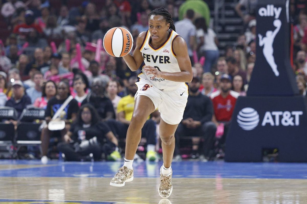 Jul 27, 2025; Chicago, Illinois, USA; Indiana Fever guard Kelsey Mitchell (0) brings the ball up court against the Chicago Sky during the first half at United Center. Mandatory Credit: Kamil Krzaczynski-Imagn Images