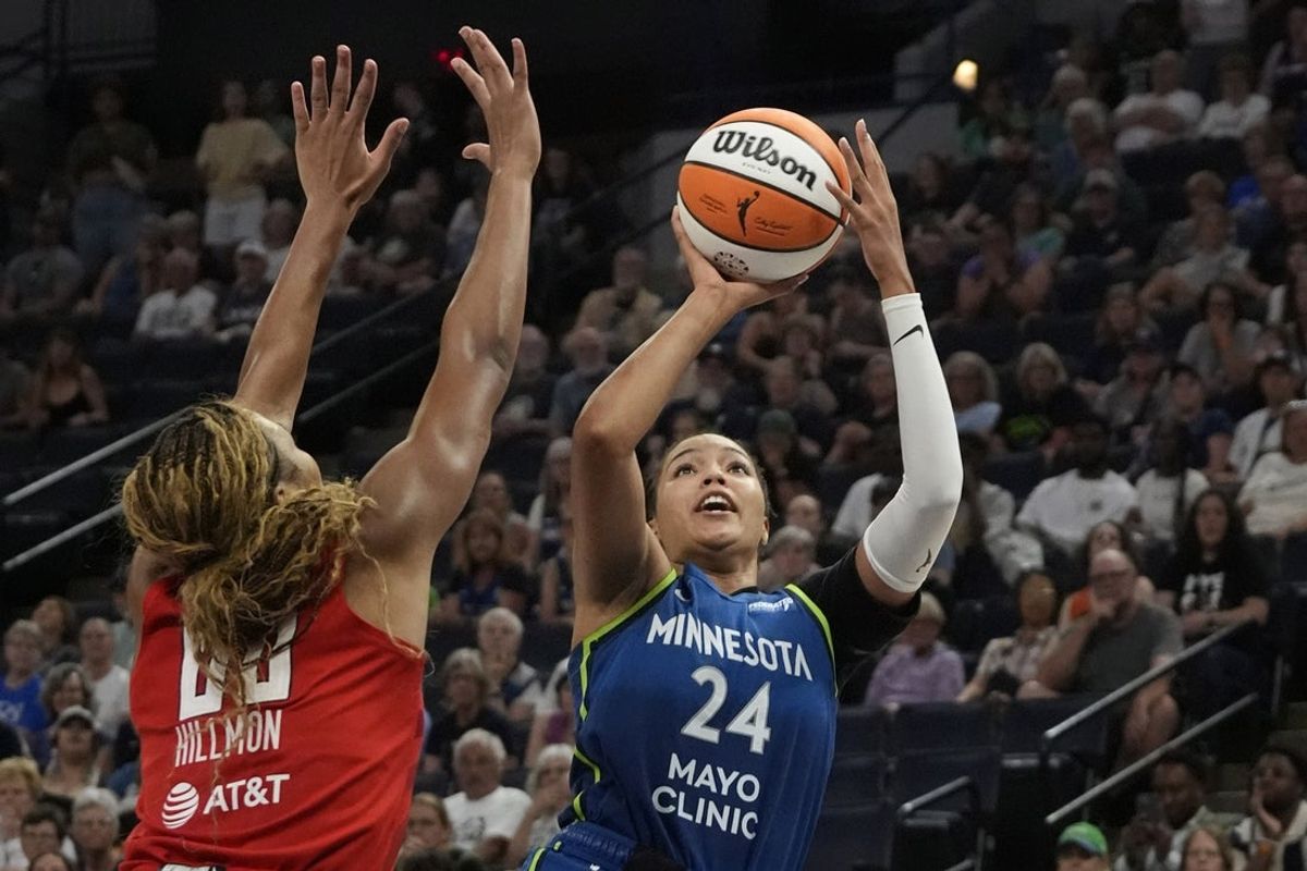 Jul 27, 2025; Minneapolis, Minnesota, USA; Minnesota Lynx forward Napheesa Collier (24) shoots against Atlanta Dream forward Naz Hillmon (00) in the fourth quarter at Target Center. Mandatory Credit: Bruce Kluckhohn-Imagn Images