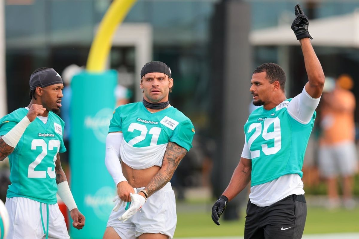 Jul 28, 2025; Miami Gardens, MI, USA; Miami Dolphins safety Minkah Fitzpatrick (right), safety Ashtyn Davis (center) and cornerback Jack Jones (left) work during training camp at Baptist Health Training Complex. Mandatory Credit: Sam Navarro-Imagn Images