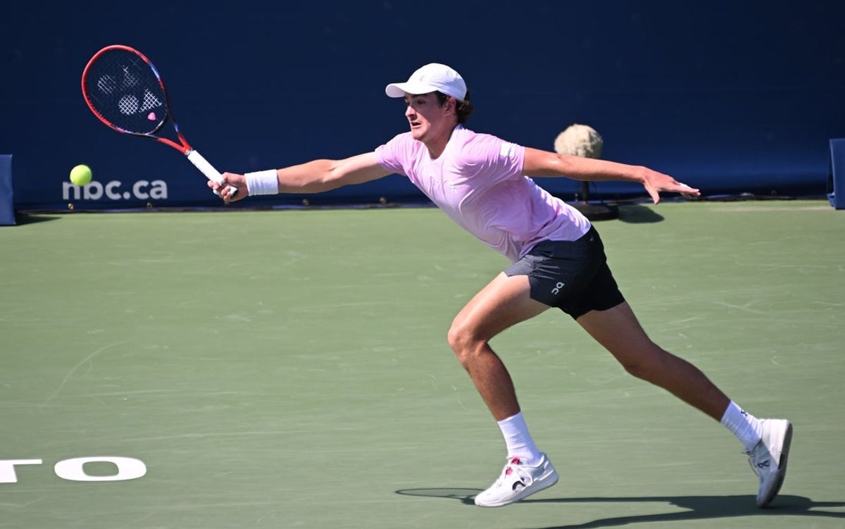 Jul 28, 2025; Toronto, ON, Canada;  Joao Fonseca (BRA) plays a shot against Tristan Schoolkate (AUS) during first round play at Sobeys Stadium. Mandatory Credit: Dan Hamilton-Imagn Images