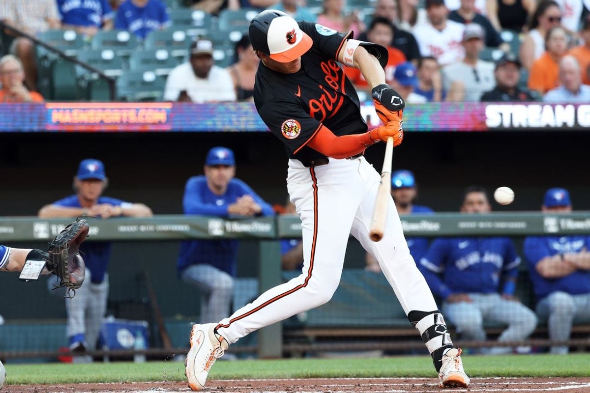 Jul 28, 2025; Baltimore, Maryland, USA; Baltimore Orioles first baseman Coby Mayo (16) hits a home run during the second inning against the Toronto Blue Jays at Oriole Park at Camden Yards. Mandatory Credit: Daniel Kucin Jr.-Imagn Images
