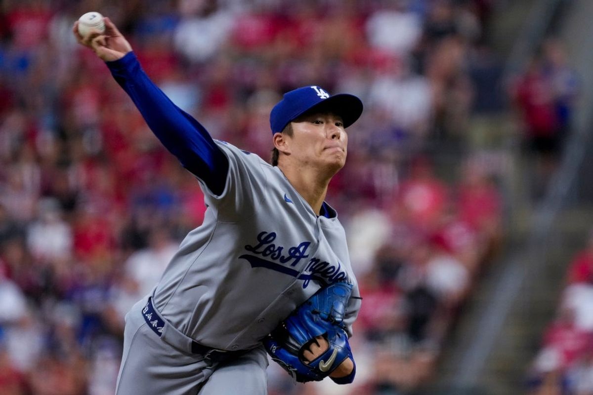 Los Angeles Dodgers pitcher Yoshinobu Yamamoto (18) throws a pitch in the first inning of the MLB National League game between the Cincinnati Reds and the Los Angeles Dodgers at Great American Ball Park in downtown Cincinnati on Monday, July 28, 2025. The game was tied 1-1 after three innings.