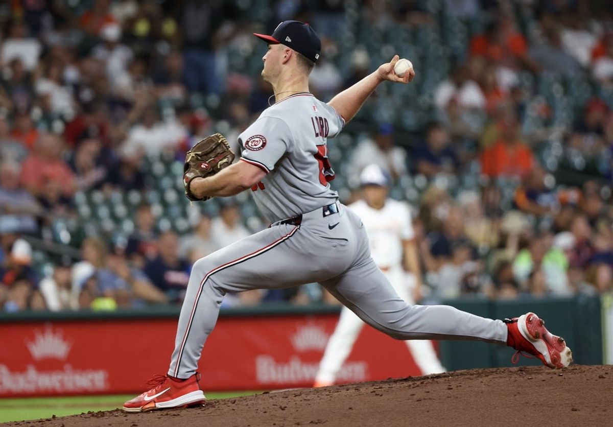 Jul 28, 2025; Houston, Texas, USA; Washington Nationals starting pitcher Brad Lord (61) pitches against the Houston Astros in the second inning at Daikin Park. Mandatory Credit: Thomas Shea-Imagn Images