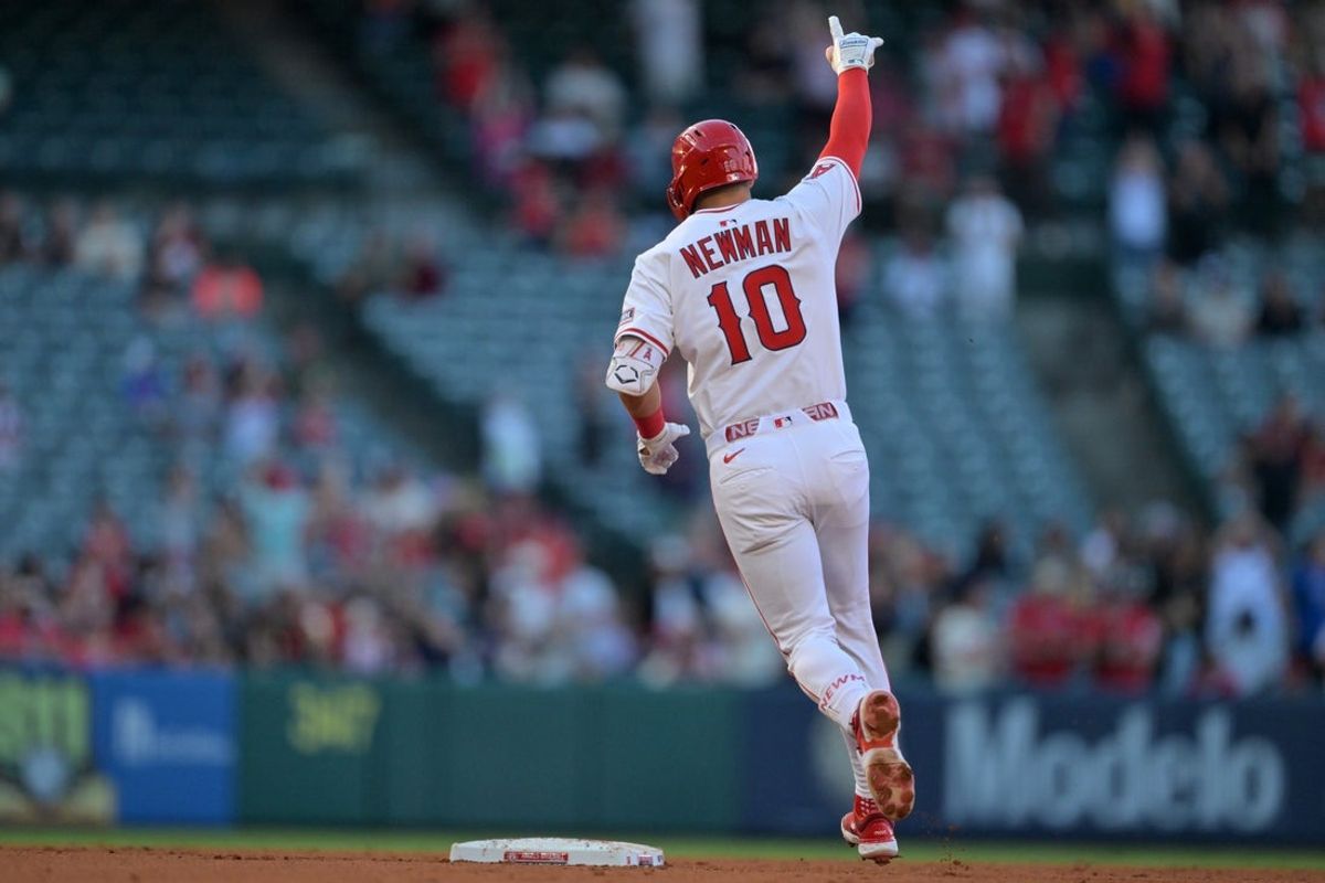 Jul 28, 2025; Anaheim, California, USA;  Los Angeles Angels third baseman Kevin Newman (10) rounds the bases after hitting a two-run home run during the third inning against the Texas Rangers at Angel Stadium. Mandatory Credit: Jayne Kamin-Oncea-Imagn Images