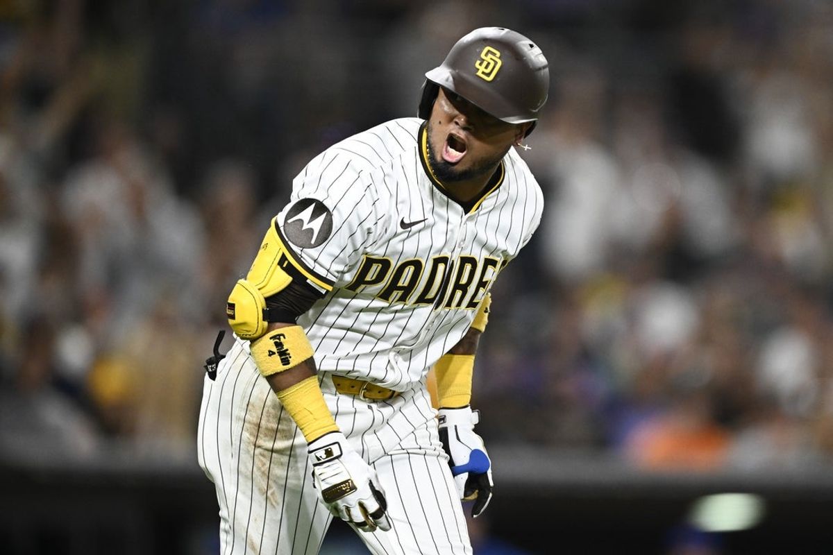 Jul 28, 2025; San Diego, California, USA; San Diego Padres first baseman Luis Arraez (4) celebrates after hititng a two-run home run during the fifth inning against the New York Mets at Petco Park. Mandatory Credit: Denis Poroy-Imagn Images