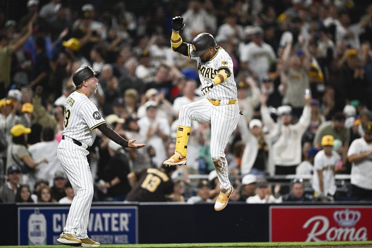 Jul 28, 2025; San Diego, California, USA; San Diego Padres first baseman Luis Arraez (4) celebrates after hititng a two-run home run during the fifth inning against the New York Mets at Petco Park. Mandatory Credit: Denis Poroy-Imagn Images