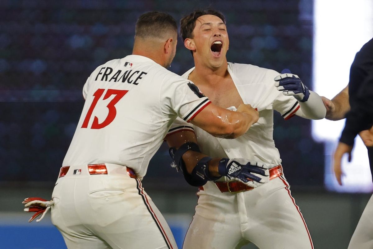 Jul 28, 2025; Minneapolis, Minnesota, USA; Minnesota Twins second baseman Brooks Lee (2) celebrates with his teammates his walk-off two run single against the Boston Red Sox in the ninth inning at Target Field. Mandatory Credit: Bruce Kluckhohn-Imagn Images