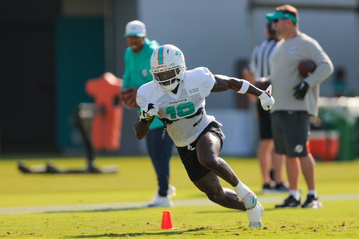 Jul 29, 2025; Miami Gardens, FL, USA; Miami Dolphins wide receiver Tyreek Hill (10) works during training camp at Baptist Health Training Complex. Mandatory Credit: Sam Navarro-Imagn Images