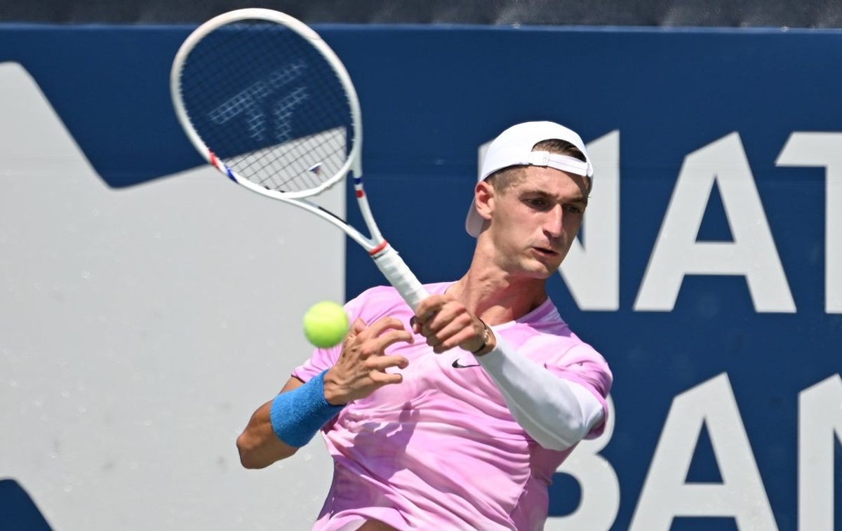 Jul 29, 2025; Toronto, ON, Canada; Ugo Humbert (FRA) plays a shot against Emilio Nava (USA)  during second round play at Sobeys Stadium. Mandatory Credit: Dan Hamilton-Imagn Images