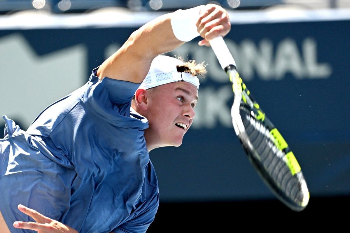 Jul 29, 2025; Toronto, ON, Canada;  Holger Rune (DEN) serves against Giovanni Mpetshi Perricard (FRA) during second round play at Sobeys Stadium. Mandatory Credit: Dan Hamilton-Imagn Images