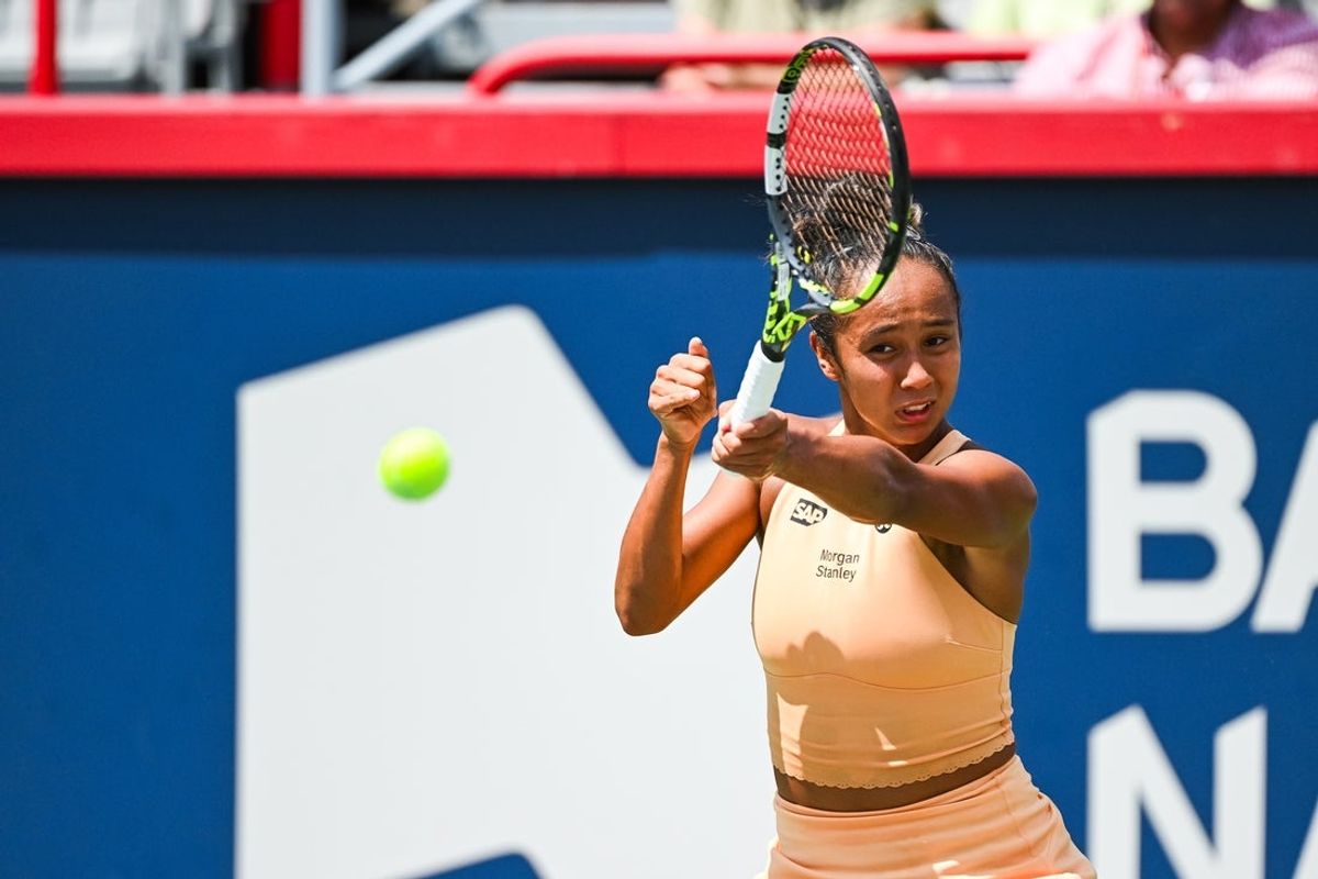 Jul 29, 2025; Montreal, QC, Canada; Leylah Fernandez (CAN) returns the ball to Maya Joint (AUS) in first round play at IGA Stadium. Mandatory Credit: David Kirouac-Imagn Images