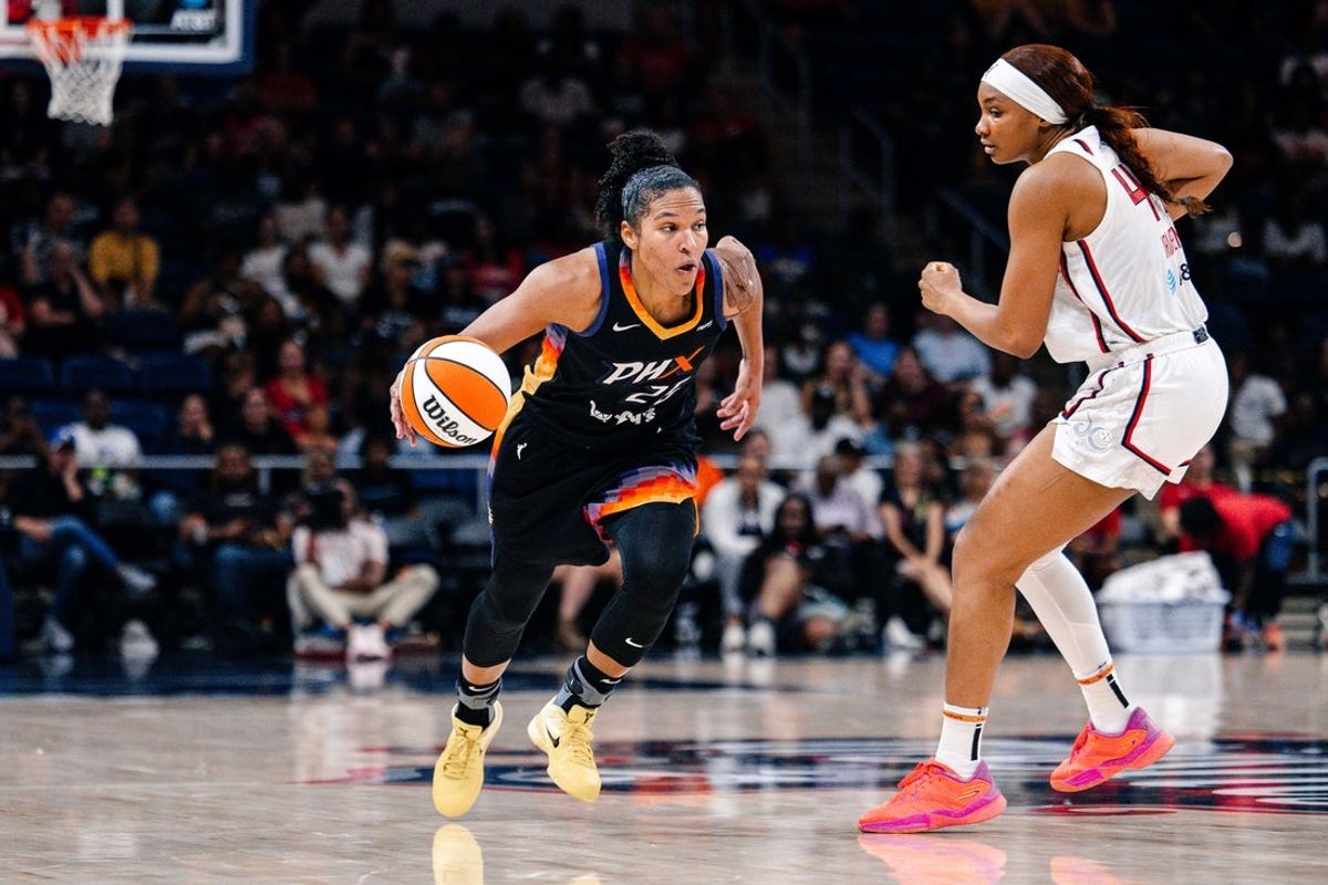 Jul 27, 2025; Washington, District of Columbia, USA; Phoenix Mercury forward Alyssa Thomas (25) dribbles past Washington Mystics forward Kiki Iriafen (44) in the second half at CareFirst Arena. Mandatory Credit: Emily Faith Morgan-Imagn Images