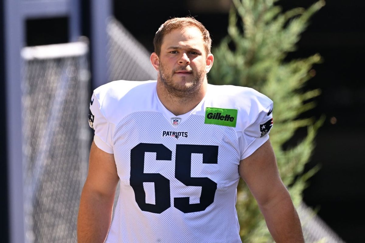 Jul 28, 2025; Foxborough, MA, USA; New England Patriots center Garrett Bradbury (65) heads to the practice fields for training camp at Gillette Stadium. Mandatory Credit: Eric Canha-Imagn Images