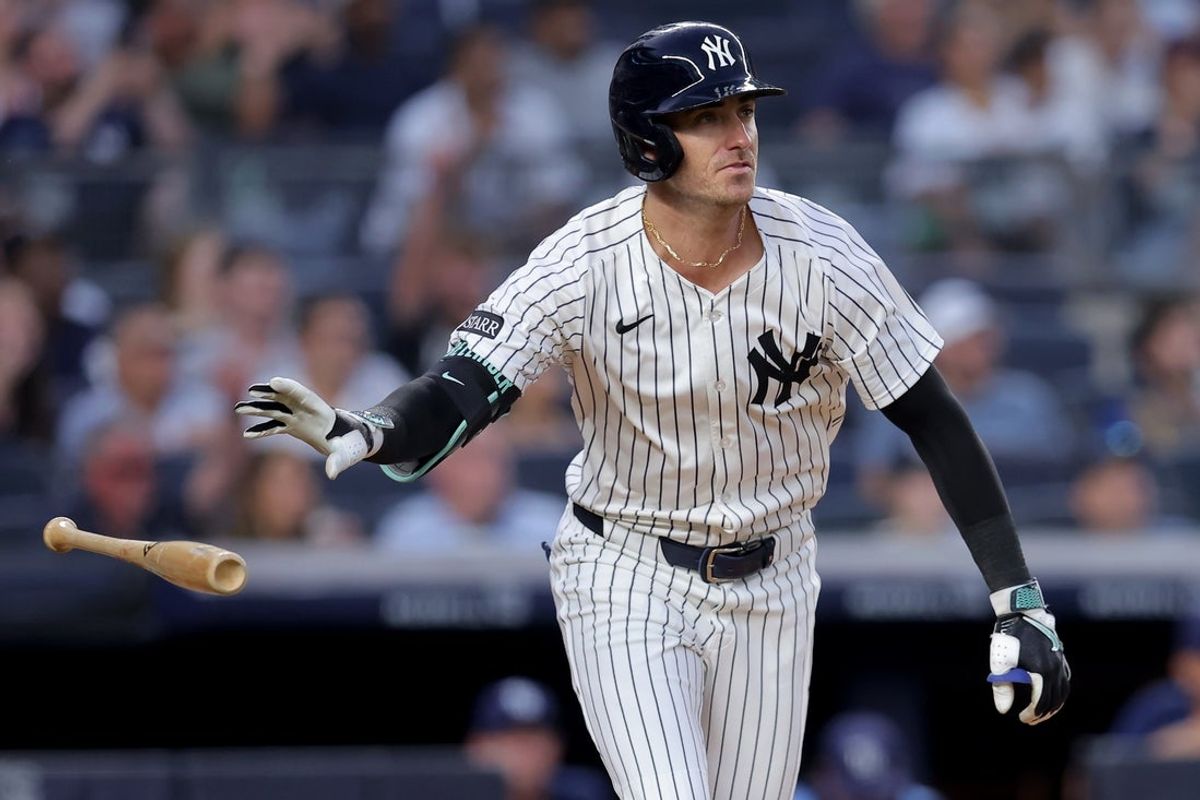 Jul 29, 2025; Bronx, New York, USA; New York Yankees right fielder Cody Bellinger (35) tosses his bat as he watches his three run home run against the Tampa Bay Rays during the third inning at Yankee Stadium. Mandatory Credit: Brad Penner-Imagn Images