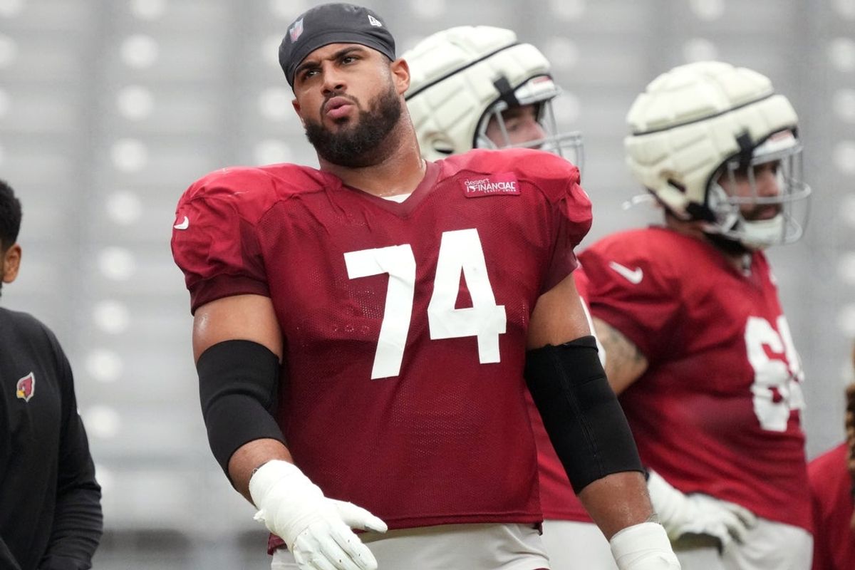 Arizona Cardinals offensive lineman Isaiah Adams (74) watches from the sidelines during the team's practice at State Farm Stadium on July 29, 2025.