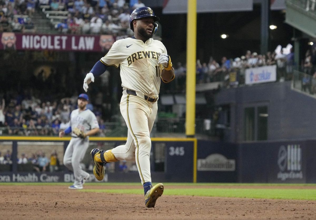 Jul 29, 2025; Milwaukee, Wisconsin, USA; Milwaukee Brewers outfielder Jackson Chourio (11) hits a triple against the Chicago Cubs in the fifth inning at American Family Field. Mandatory Credit: Michael McLoone-Imagn Images