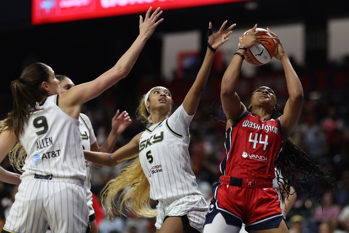 Jul 29, 2025; Washington, District of Columbia, USA; Washington Mystics forward Kiki Iriafen (44) rebounds the ball in front of Chicago Sky forward Angel Reese (5) ad Sky guard Rebecca Allen (9) in the second half at CareFirst Arena. Mandatory Credit: Geoff Burke-Imagn Images