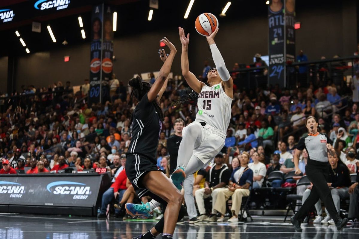 Jul 29, 2025; College Park, Georgia, USA; Atlanta Dream guard Allisha Gray (15) shoots the ball against Golden State Valkyries guard Tiffany Hayes (15) during the third quarter at Gateway Center Arena at College Park. Mandatory Credit: Jordan Godfree-Imagn Images