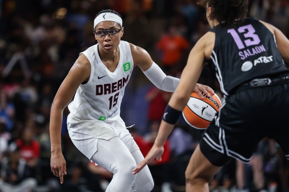 Jul 29, 2025; College Park, Georgia, USA; Atlanta Dream guard Allisha Gray (15) controls the ball against Golden State Valkyries forward Janelle Salaun (13) during the fourth quarter at Gateway Center Arena at College Park. Mandatory Credit: Jordan Godfree-Imagn Images