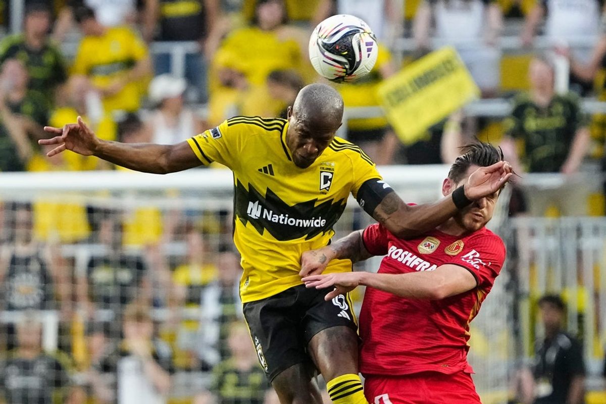 Columbus Crew midfielder Darlington Nagbe (6) heads a ball over Toluca FC midfielder Jesus Angulo (10) during the second half of the Leagues Cup match at Lower.com Field in Columbus on July 29, 2025. The Crew lost 4-2 in penalty kicks after a 2-2 draw in regulation.