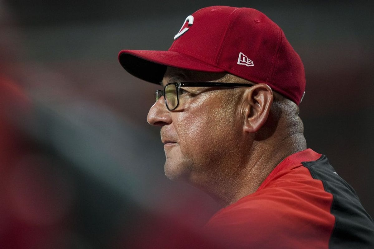 Jul 29, 2025; Cincinnati, Ohio, USA;  Cincinnati Reds manager Terry Francona (77) watches from the dugout during the game against the Los Angeles Dodgers in the eighth inning at Great American Ball Park. Mandatory Credit: Aaron Doster-Imagn Images
