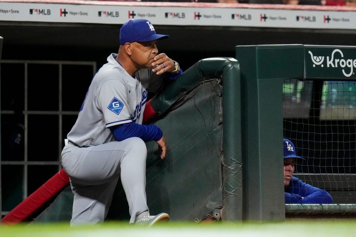 Los Angeles Dodgers manager Dave Roberts (30) looks on from the dugout in the ninth inning of the MLB National League game between the Cincinnati Reds and the Los Angeles Dodgers at Great American Ball Park in downtown Cincinnati on Tuesday, July 29, 2025. The Dodgers won 5-4.