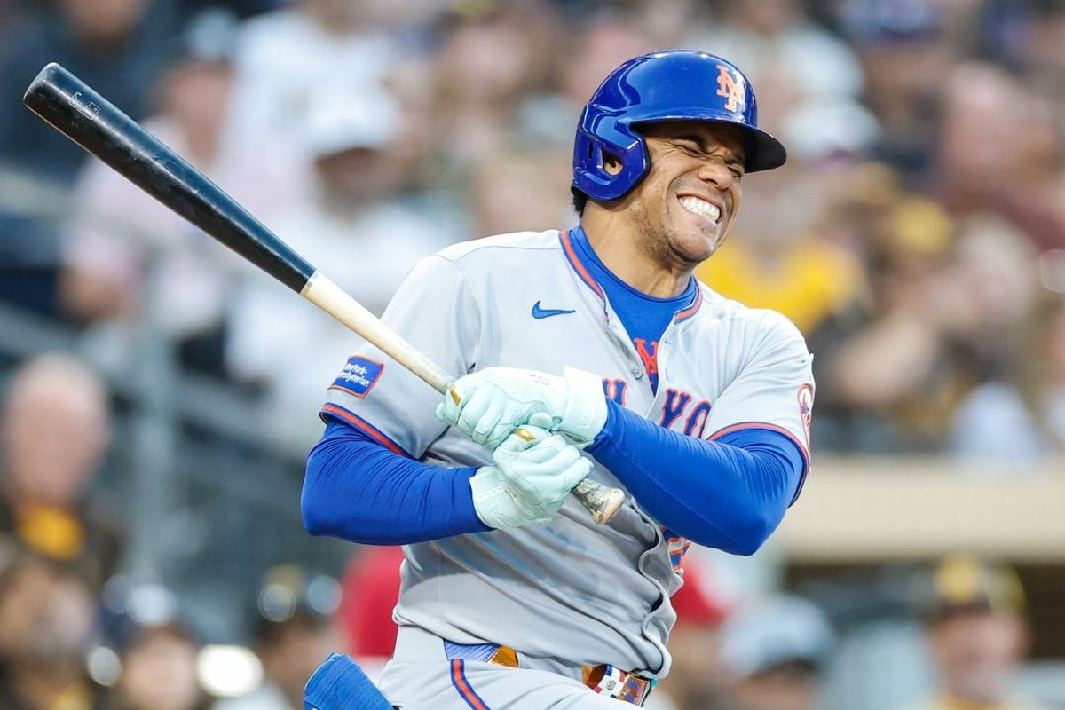 Jul 29, 2025; San Diego, California, USA; New York Mets right fielder Juan Soto (22) reacts after fouling off a ball off his lower extremity during the fourth inning against the San Diego Padres at Petco Park. Mandatory Credit: David Frerker-Imagn Images