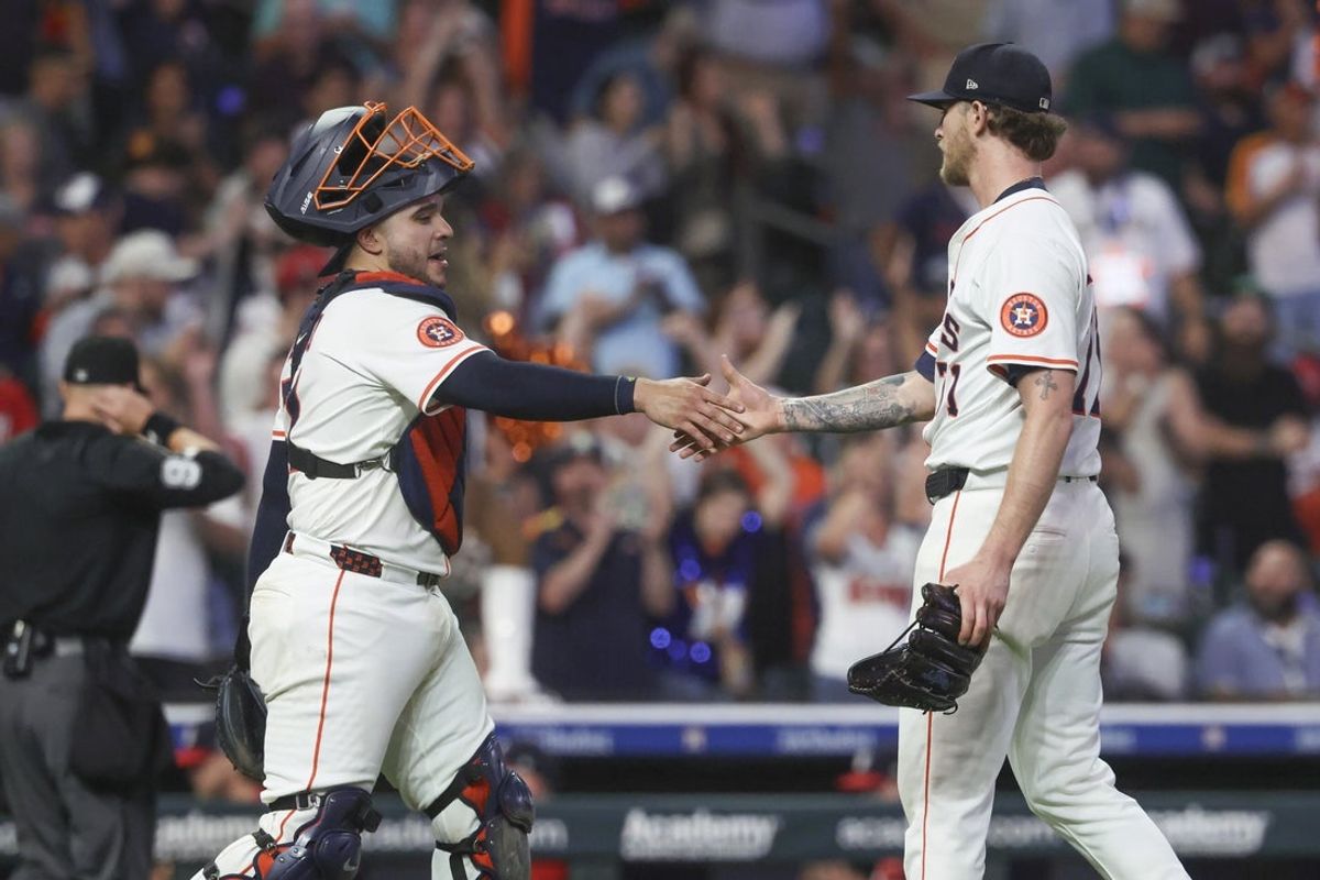 Jul 29, 2025; Houston, Texas, USA; Houston Astros catcher Yainer Diaz (21) and relief pitcher Josh Hader (71) celebrate after the game against the Washington Nationals at Daikin Park. Mandatory Credit: Troy Taormina-Imagn Images