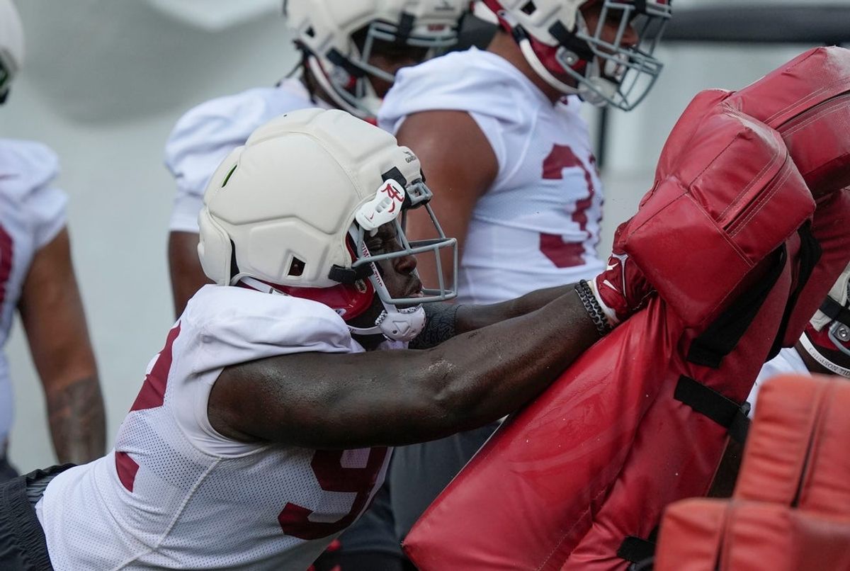 July 30, 2025; Tuscaloosa, AL, USA; defensive lineman Jeremiah Beaman hits the sled during the first practice session of the preseason for the Alabama Crimson Tide.