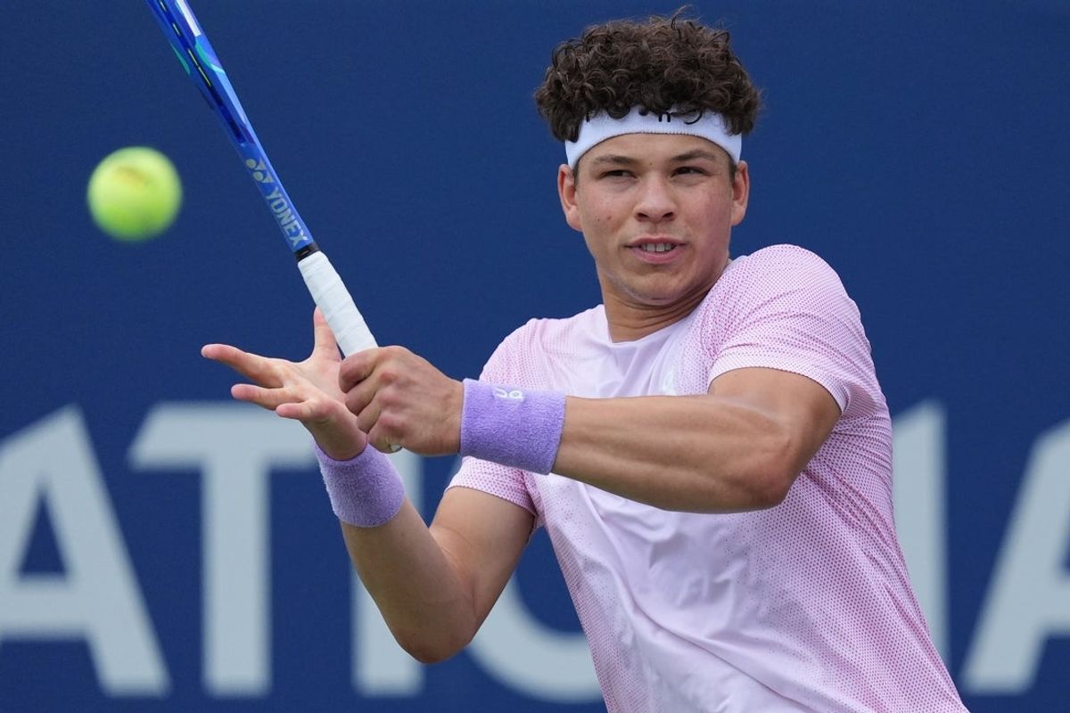 Jul 30, 2025; Toronto, ON, Canada; Ben Shelton (USA) hits a ball to Adrian Mannarino during the second round at Sobeys Stadium. Mandatory Credit: John E. Sokolowski-Imagn Images