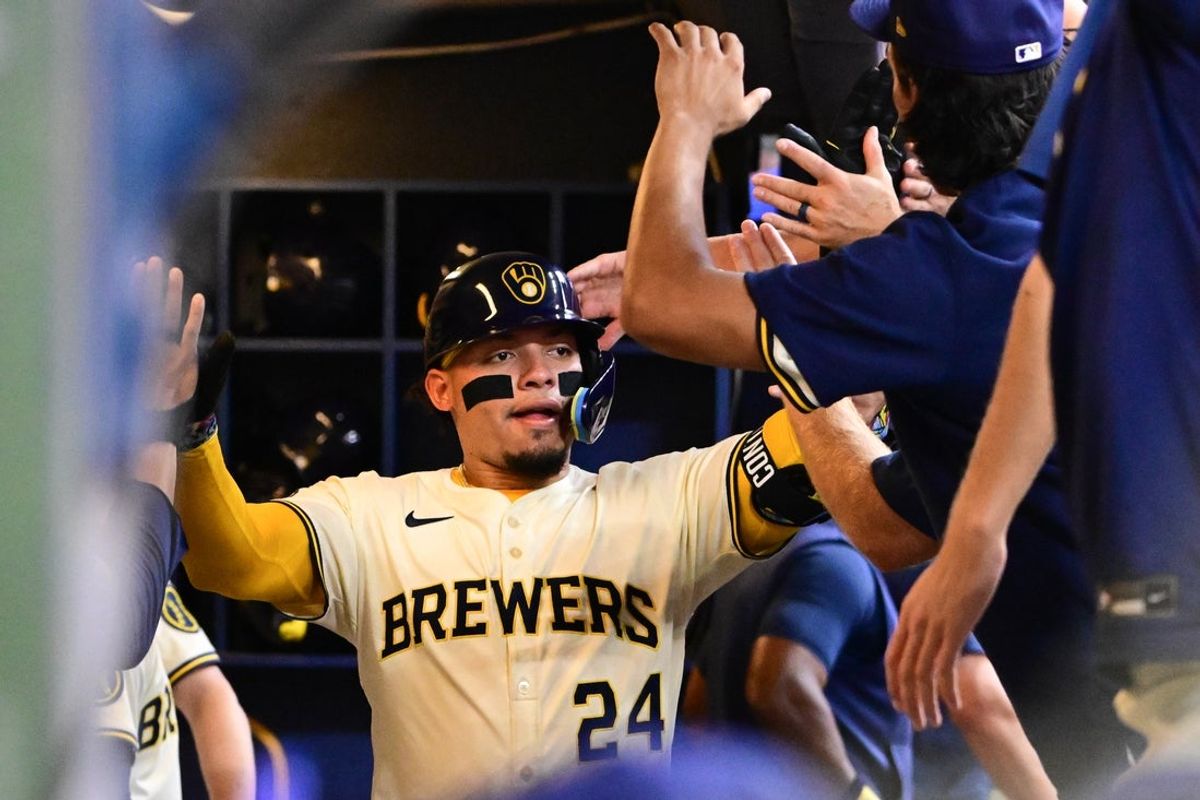Jul 30, 2025; Milwaukee, Wisconsin, USA; Milwaukee Brewers catcher William Contreras (24) is greeted after hitting a solo home run in the first inning against the Chicago Cubs at American Family Field. Mandatory Credit: Benny Sieu-Imagn Images