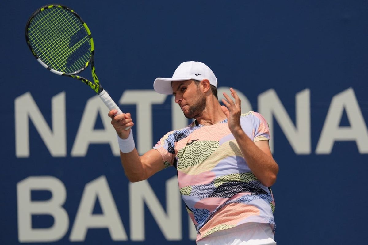 Jul 30, 2025; Toronto, ON, Canada; Aleksandar Vukic (AUS) returns a ball to Cameron Norrie (not pictured) during the second round at Sobeys Stadium. Mandatory Credit: John E. Sokolowski-Imagn Images
